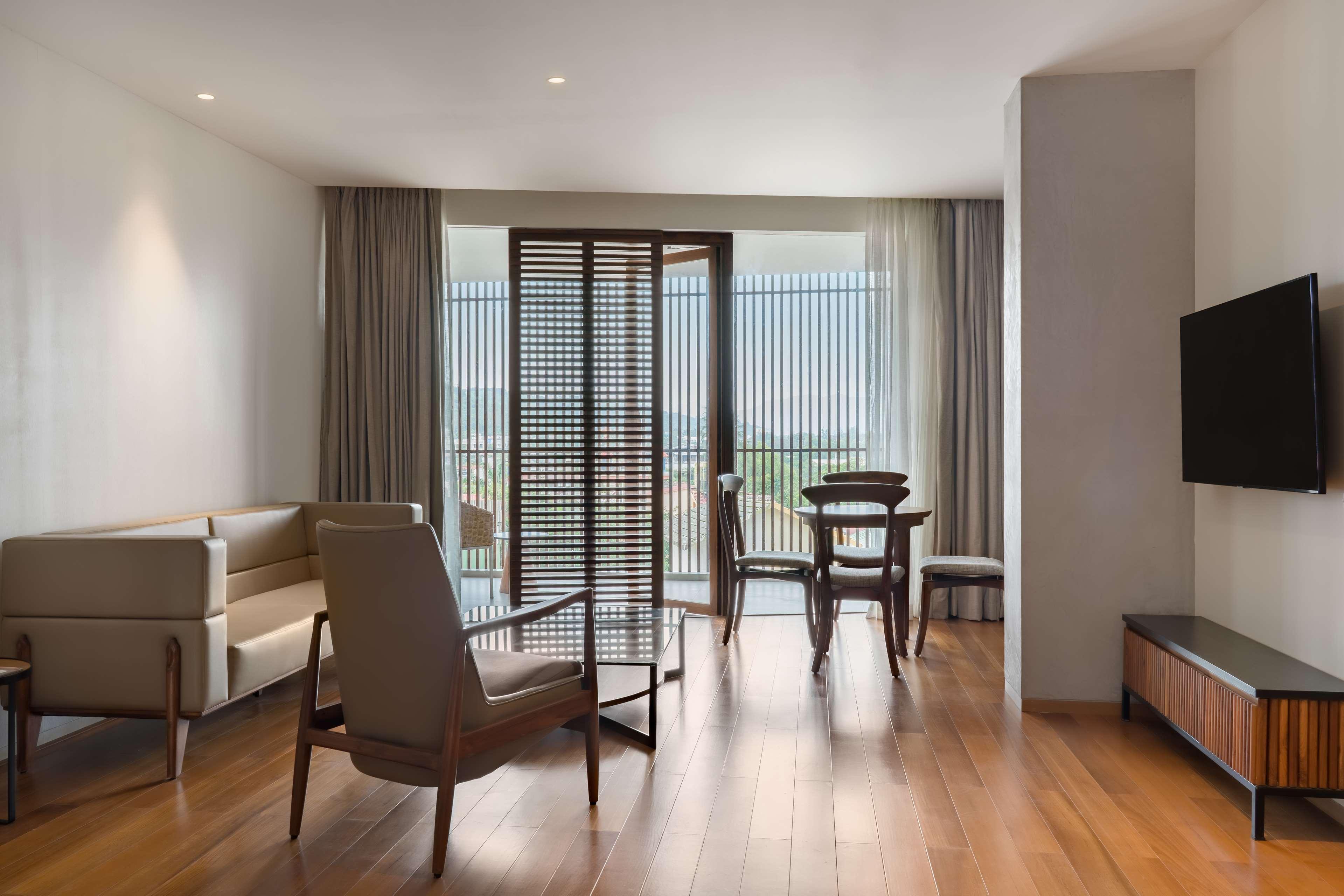 Radisson Resort And Spa Lonavala Bagian luar foto A typical living room in a typical apartment